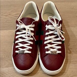 Gucci men’s Ace’s Burgundy Leather Sneakers with White Accents